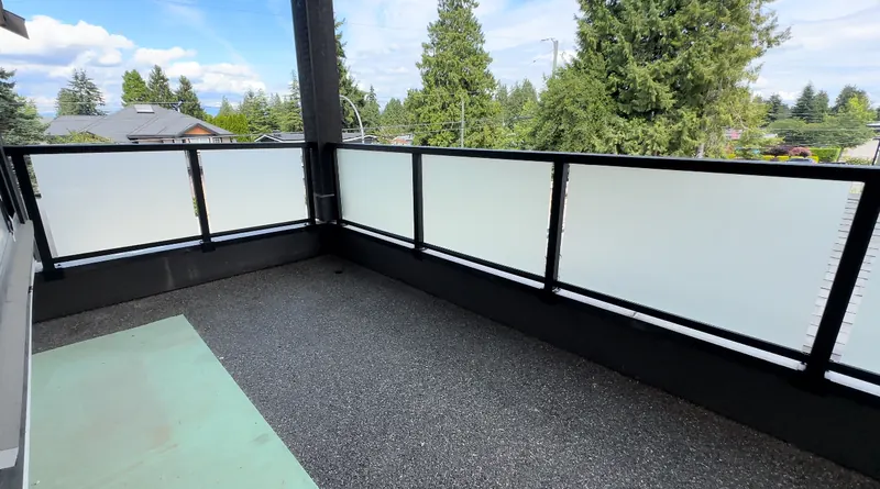 Frosted glass panels on a covered balcony