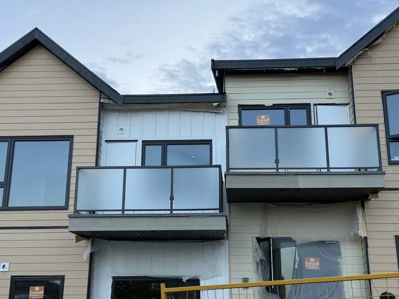 Frosted glass balconies on a new townhouse build