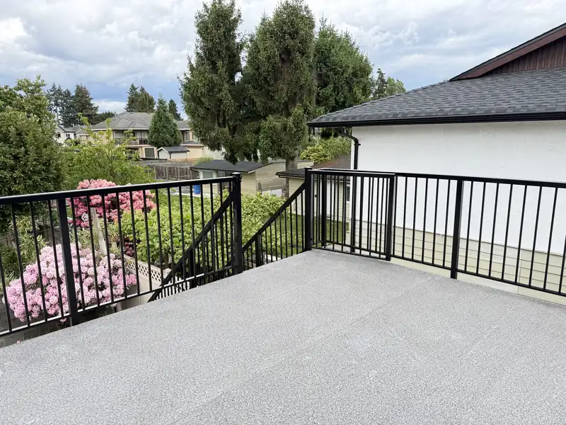 Wrap-around deck railing with a gate opening to stairs