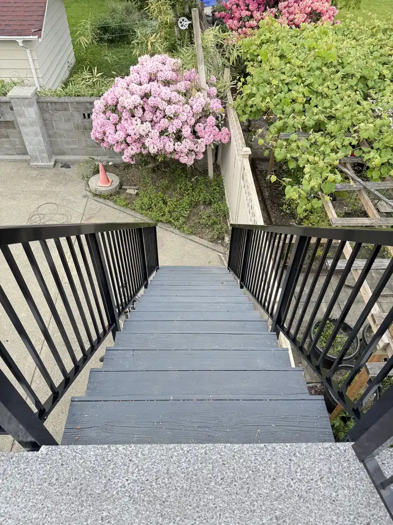 Looking down a picket stair run to a walkway